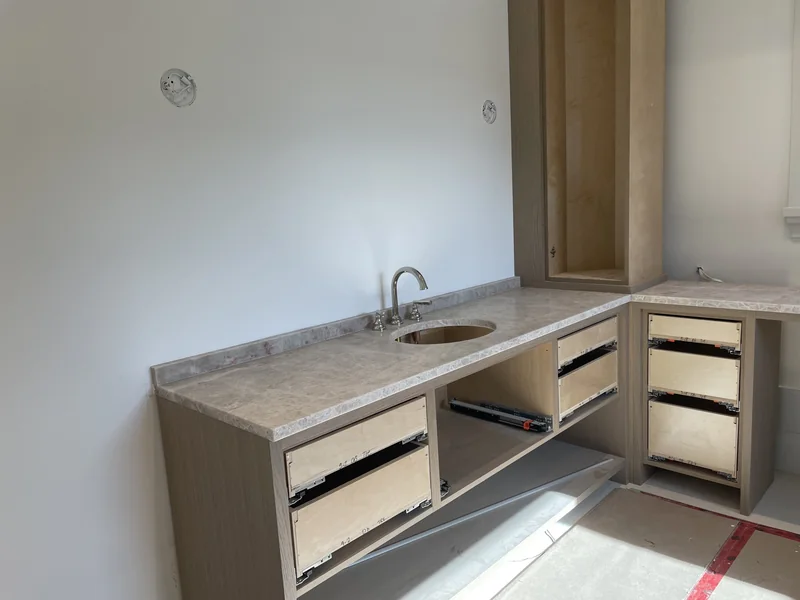 Corner detail of a long vanity surface