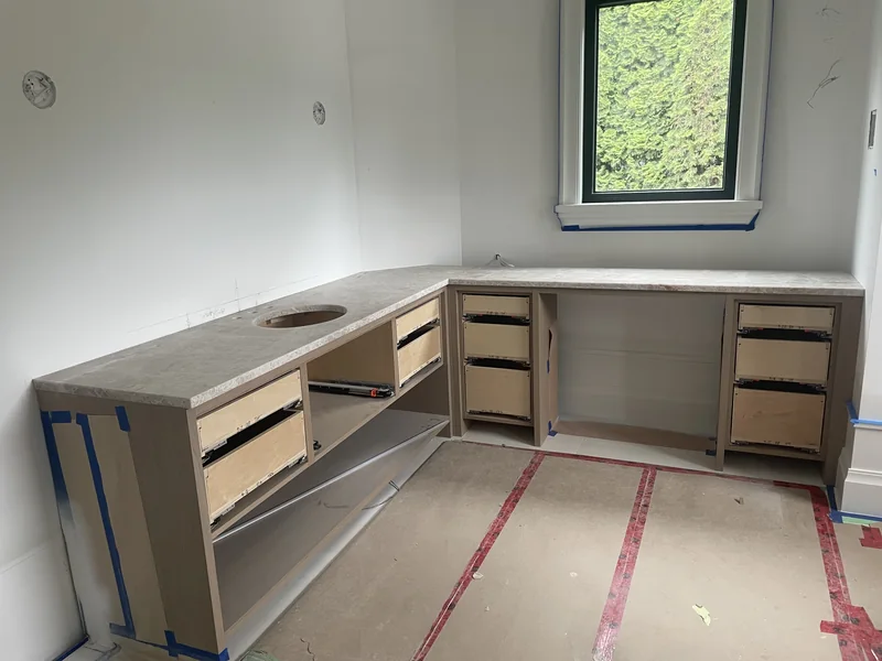 L-shaped vanity countertop during installation