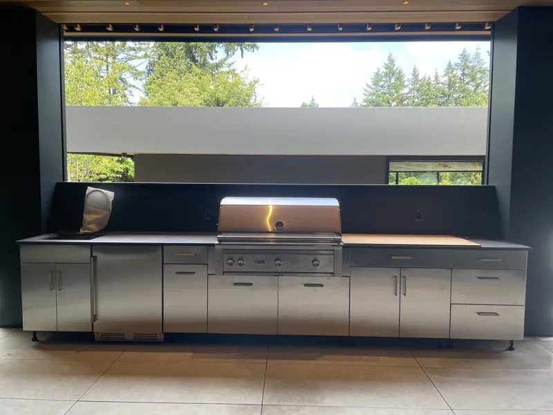 Outdoor cooking counter around a built-in grill