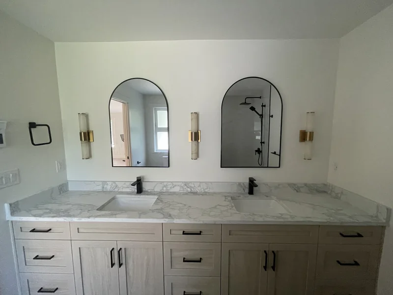 White veined double vanity with black taps