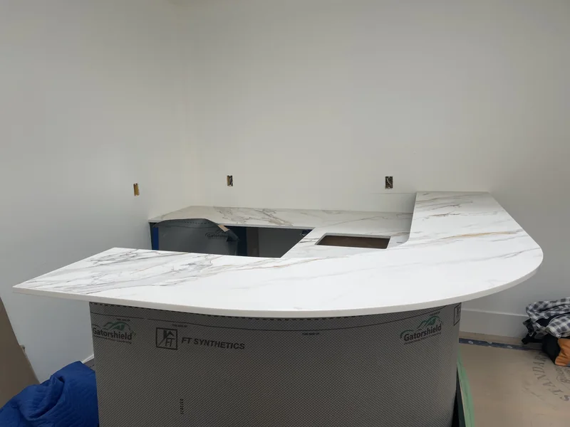 Curved raised bar with a lower sink counter