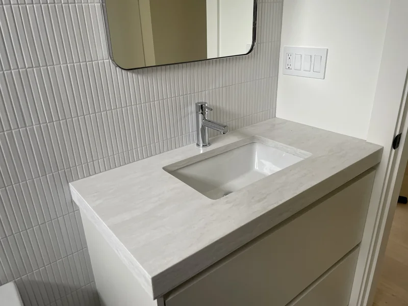 Single-basin vanity with a softly rounded front corner