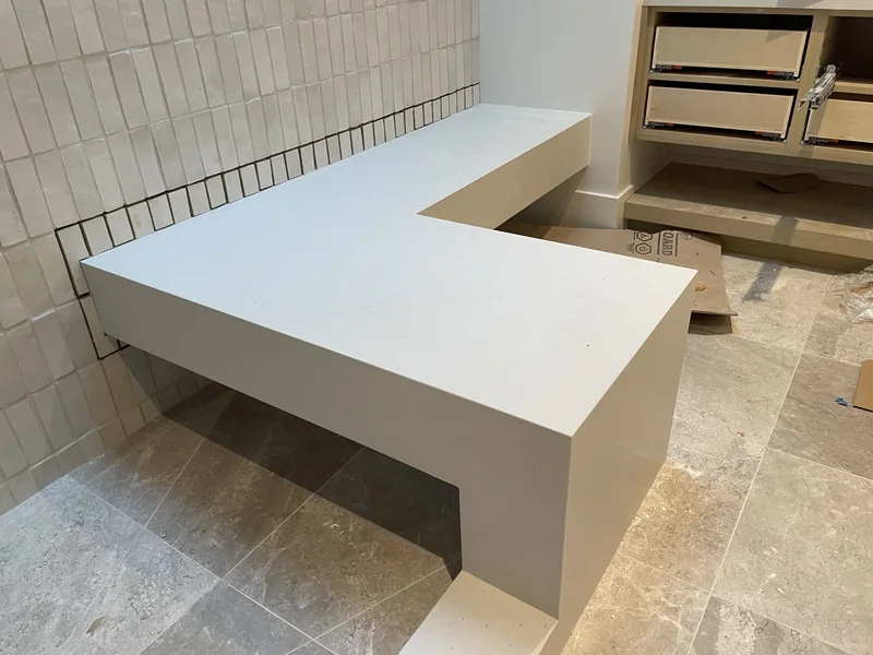 L-shaped shower bench with a vertical end panel
